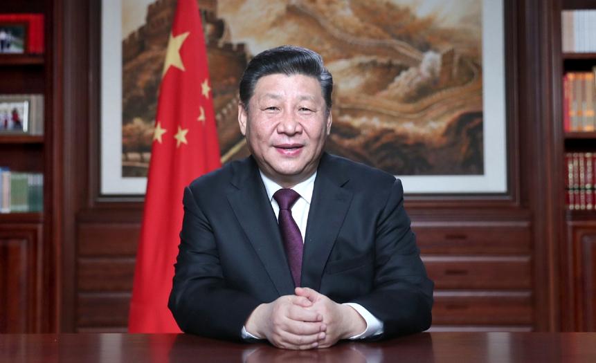 President Xi Jinping delivers his New Year's speech in his office in Beijing.